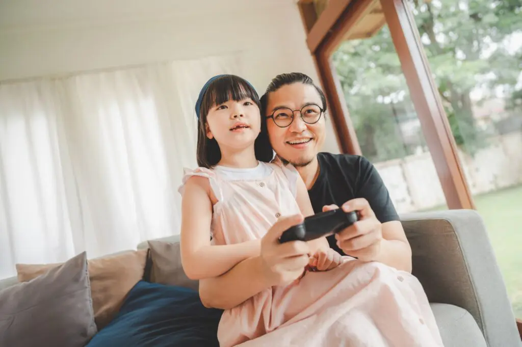 father-and-daughter-playing-video-game